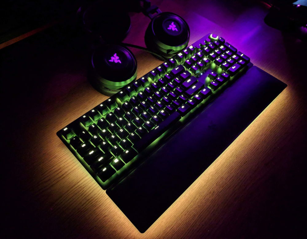 The Razer Huntsman Elite's Opto-Mechanical switches feel and sound great. The magnetic removable RGB wrist-wrest is quite the head-turner. Pictured, you can also see the Nari Ultimate, which has been my daily driver for PC gaming.