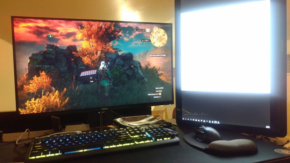 Monitors with keyboard and mouse playing Witcher 3
