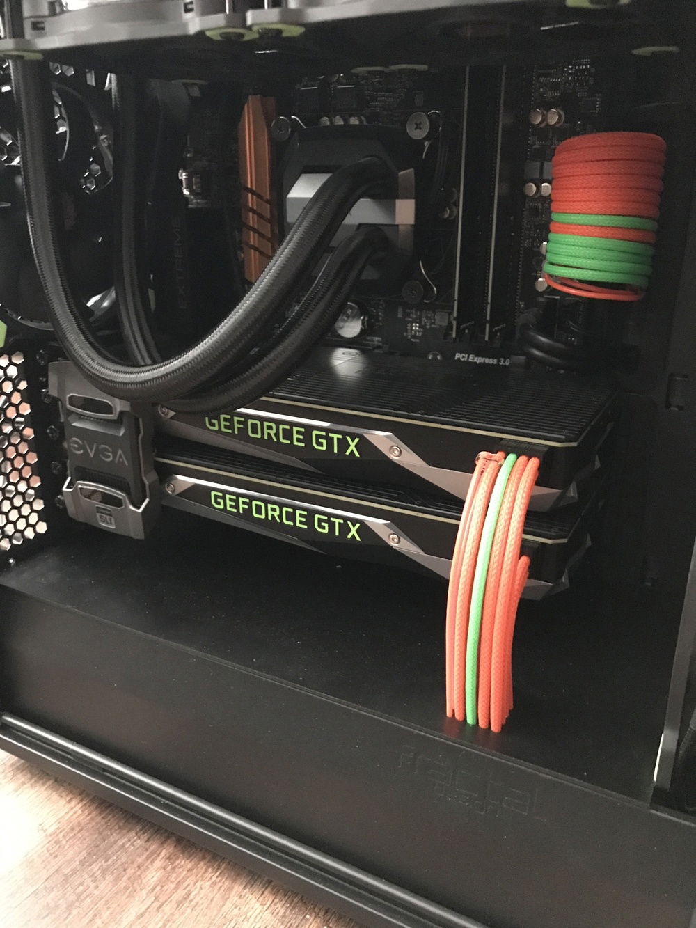 Powered off. The bottom panel that the cables disappear inside of is an acrylic sheet painted black. The holes were made by hand with a Dremel and loads of patience