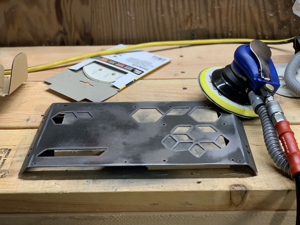 Rear panel plasma cut out and bent into shape. Had to Dremel the lines straight that were cut wavy by the CNC plasma cutter (I should have had it water jetted). Slipped with the Dremel a few times so I bought a DA to sand out the imperfections. Goes in for powder coating Monday!
