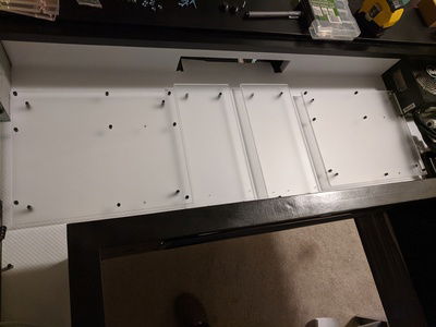 Acrylic mounting plates now attached to the desk via the standoffs.  Note the GPU plates still need additional work that can't be done until the actual PC build.