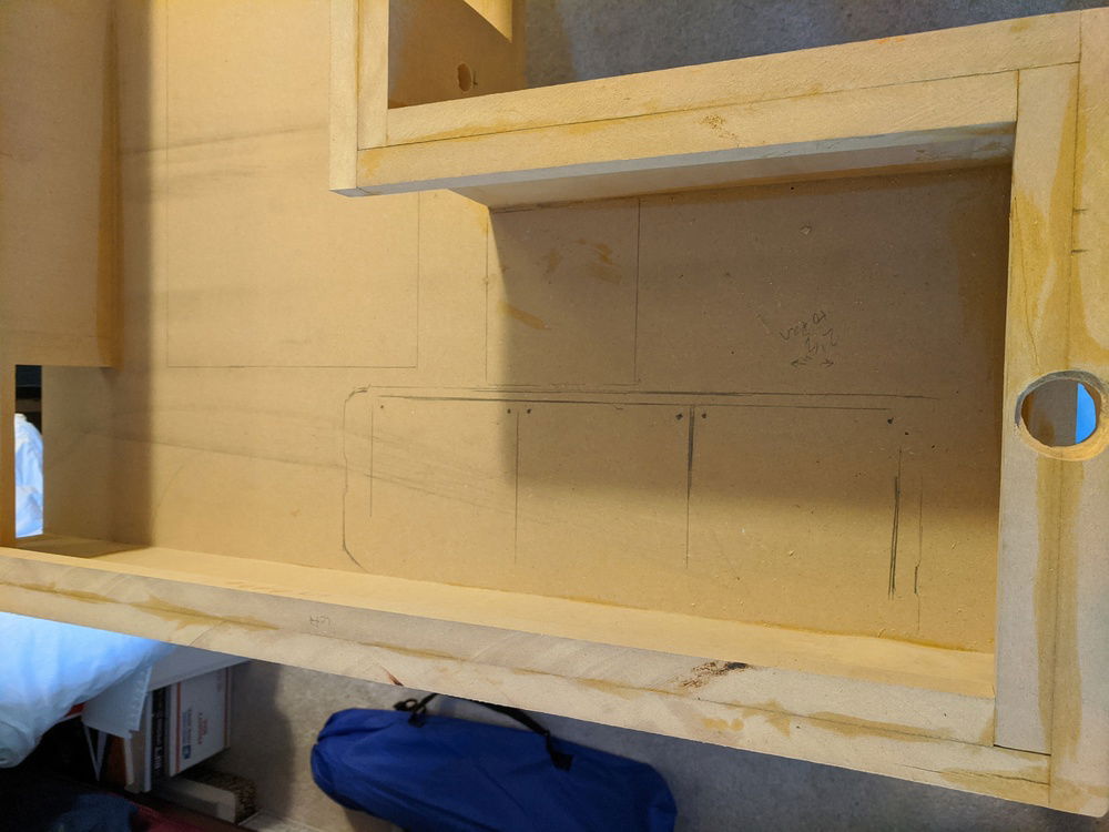 Holes were drilled for the fill ports that attach to the resesrvoirs.  I mangled them a little bit but paint and the ports themselves should help minimize the visibility.  Also, radiator and drive bay mounts have been sketched here.