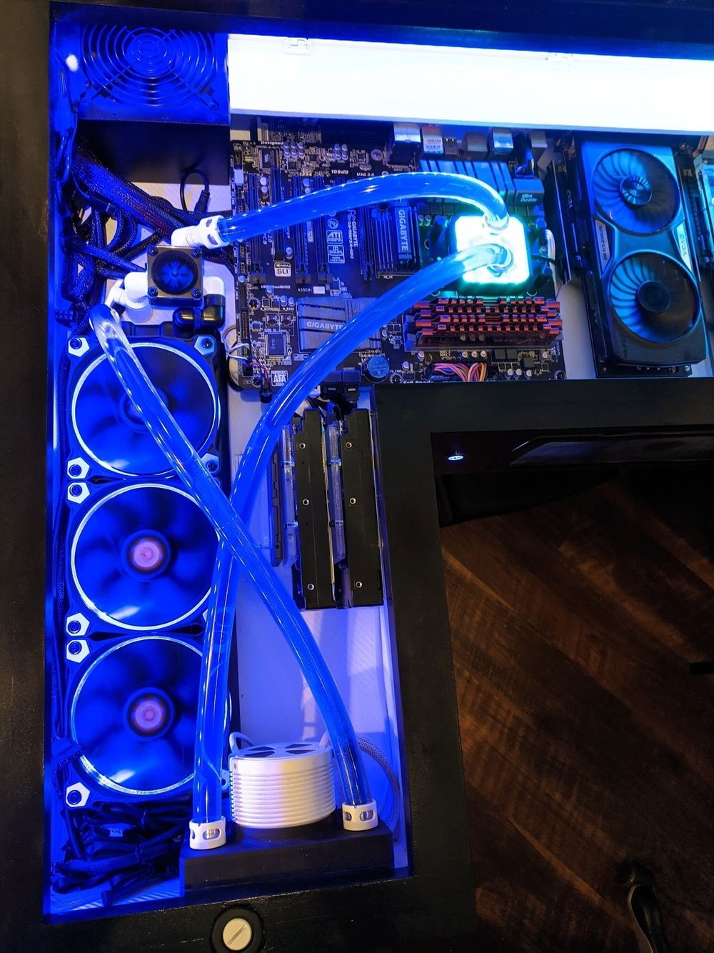 Multi-purpose server half of the desk.  Does it need water cooling?  Absolutely not.  Does it look awesome?  Heck yeah.