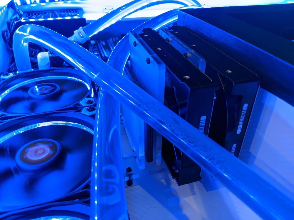 Acrylic plate mounting system I designed for the HDDs and SSD.  I can easily store another SSD mount on here or remove the SSD and add another HDD.  The opposite side of the desk has the same system, but only one SSD on it since I have two M.2 NVMe drives on the motherboard.