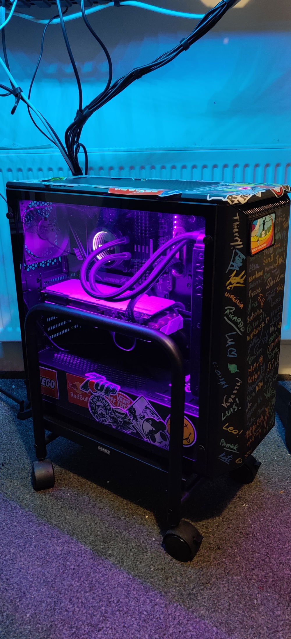 The inside is lit up a pinkish purple to match the turquoise led that sits under my standing desk. The pc also sits on a holder with wheels so that I can move the PC around easily if needed and also does not sit directly on carpet flooring.