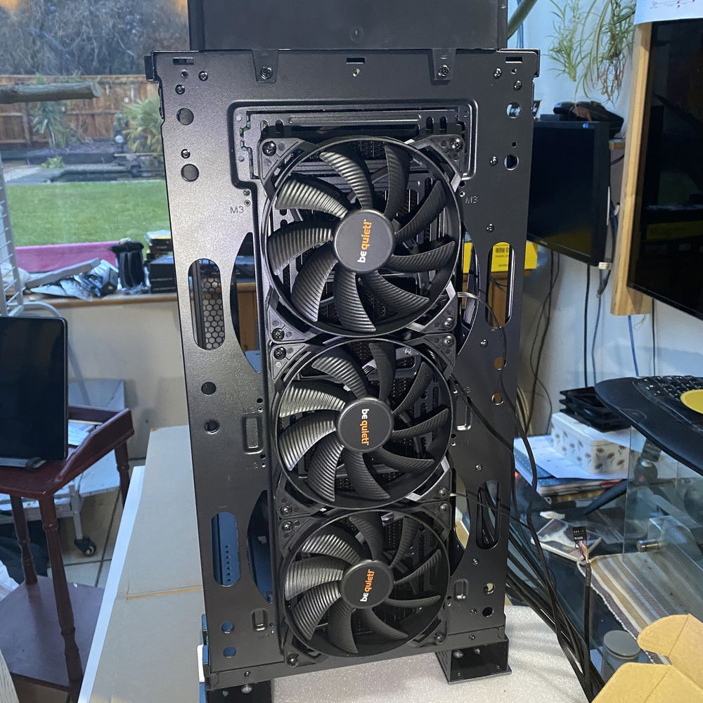 3 x 140 fans in front of the 420 slim radiator at the front