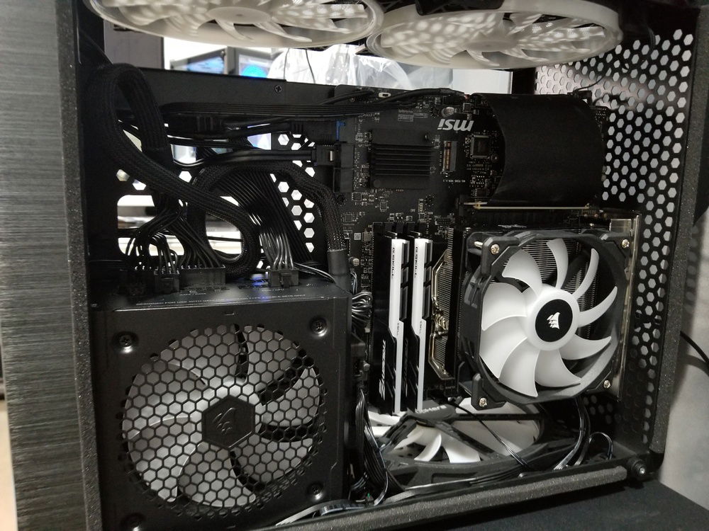 As seen from the CPU side. Pic is prior to obtaining the GPU. I had swapped the original Big Shuriken 3 Cooler's fan for a Corsair SP120, but after putting on the glass panel, I felt that the height ended up restricting airflow too much against the glass. I subsequently swapped it to a 120x15mm Noctua Chromax Black Slim Fan afterwards.