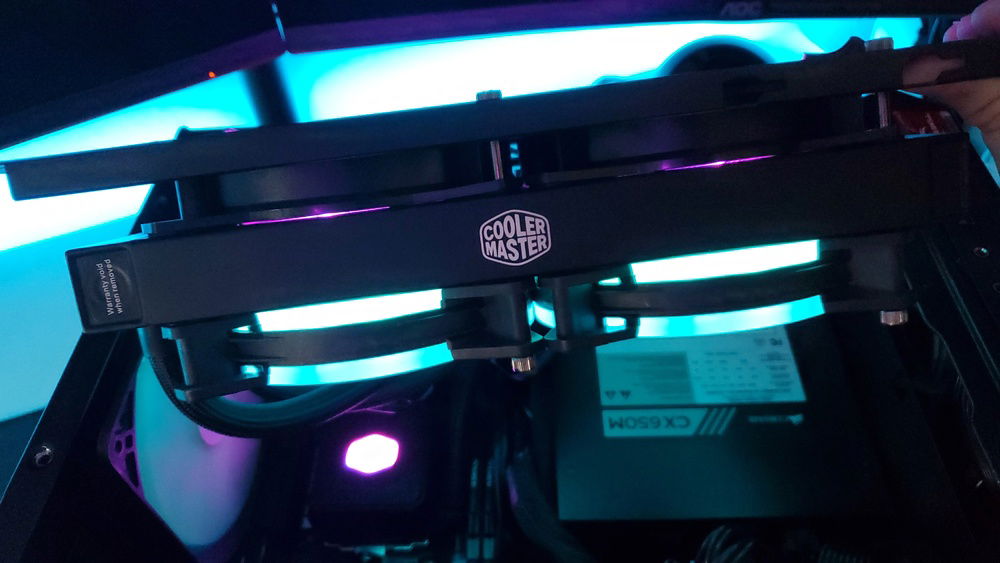 View of the side of the push-pull setup. 2 CM fans that came with the aio and 2 uphere rgb fans pulling air through. Relatively loud though I don't mind it as I have a fan running in my room all the time and it isn't any louder than that even though the fan is across the room and the pc is next to me while gaming.