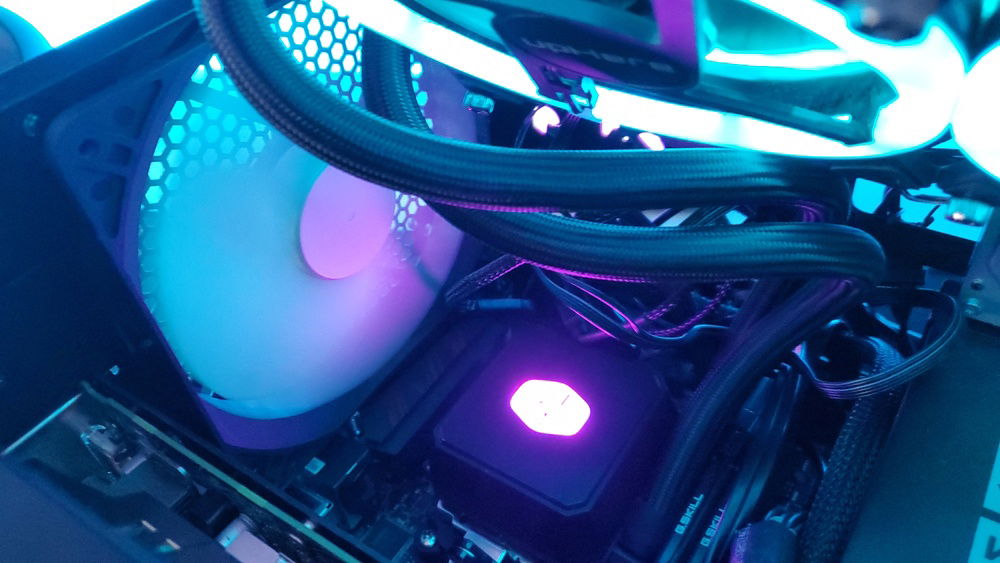 View of inside pc while its on, including pump/block for aio and the ram, as well as the preinstalled 140mm fractal design fan that is pretty quiet and I put back in the build after the uphere fan that was in its place failed. I guess that's what you get for a $25 3-pack of rgb fans.