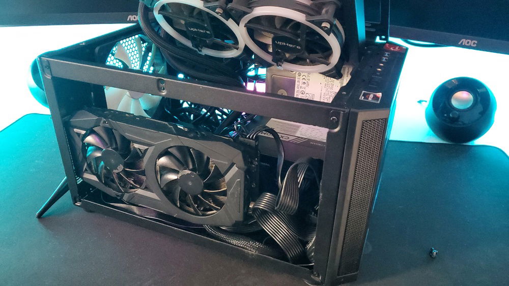 Another GPU-side view of pc with the rad lifted up, showing some of the inside and the bottom fans while off.