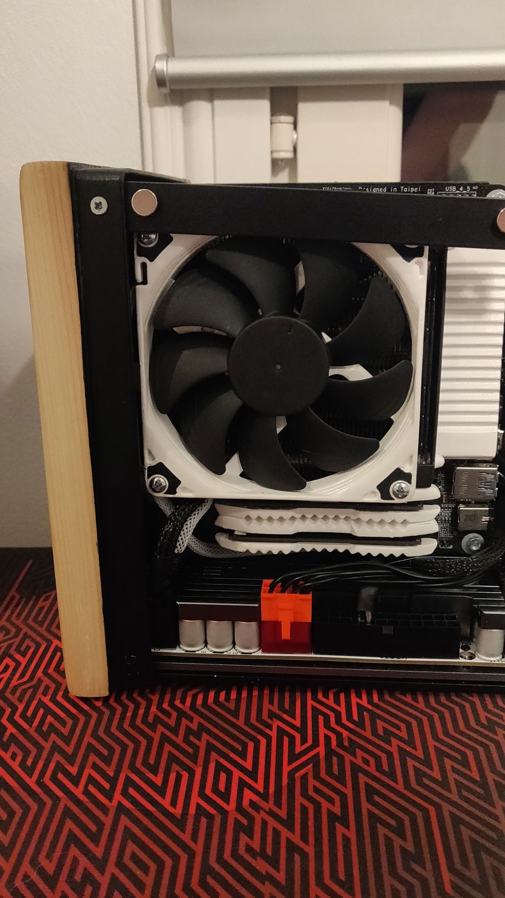 Add the back panel, screwed in with the metal frame thingy from bottom