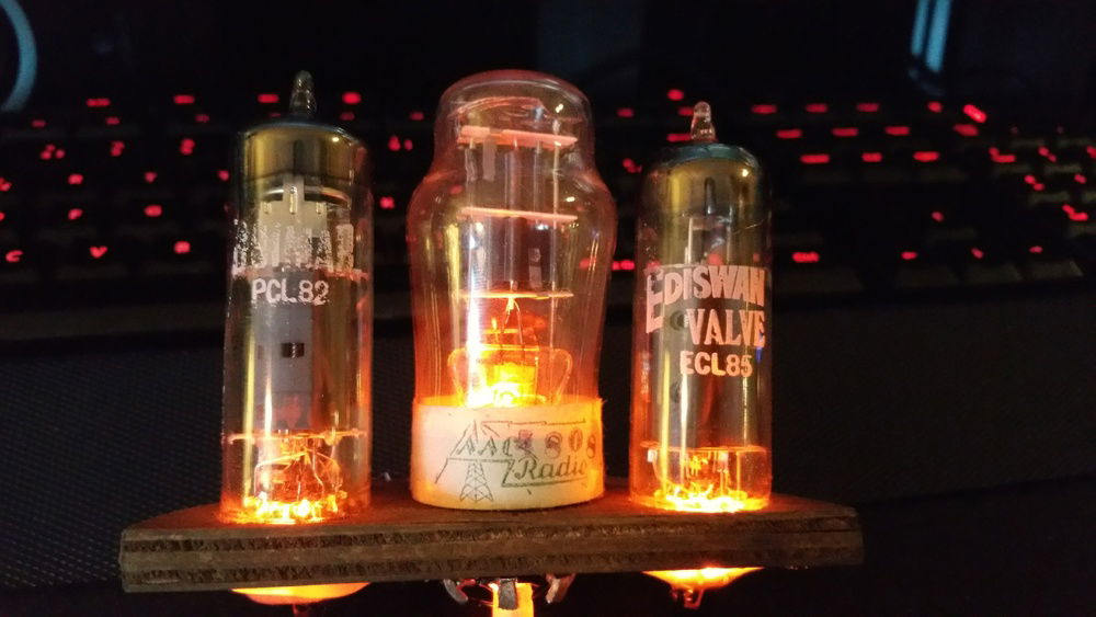 Detail shot of vacuum tubes that is enclosed under glass on top left side of top cover.