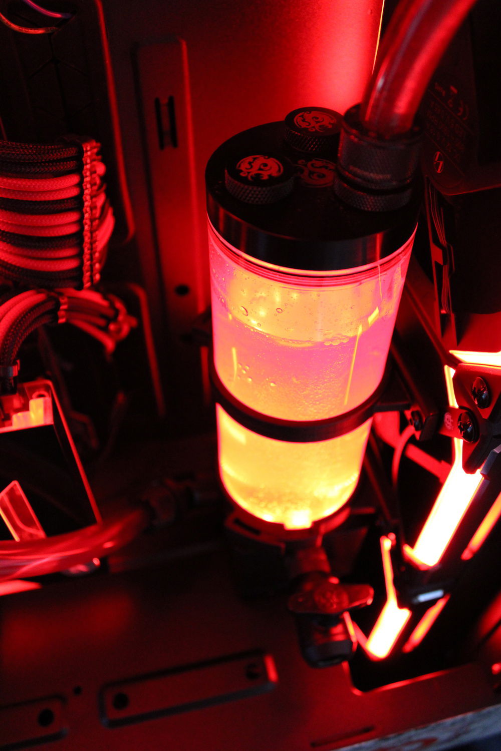 Close up of our Bitspower Touchaqua Tarasque II 360S Radiator and their DDC Reservoir/Pump Combo 150 RGB-PWM. Our Res is set to a static red for the RGB.