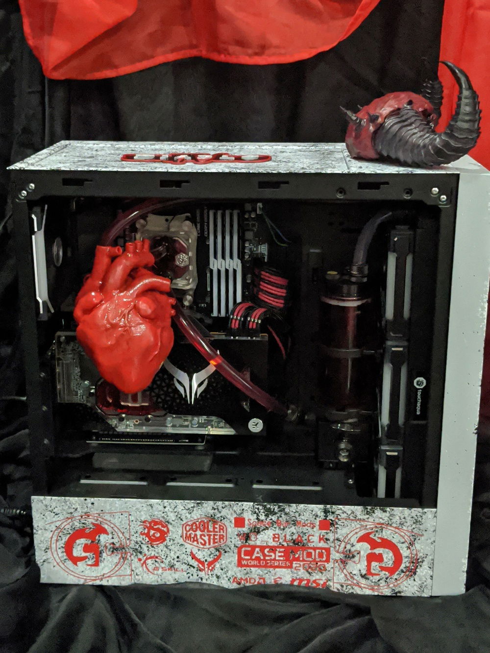 A better look at our heart which was 3D printed in 4 separate pieces then adhered using resin. Once together we were able to make channel in the arteries for our soft tubing to go through. We then hand painted the heart using model paints.
