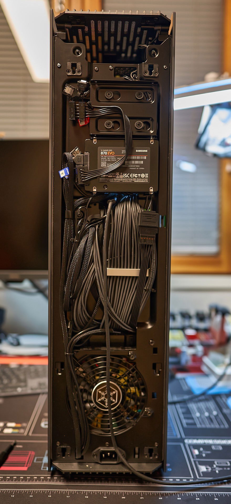 Cable management behind the rear panel. Couldn't use cable covers due to limited space.