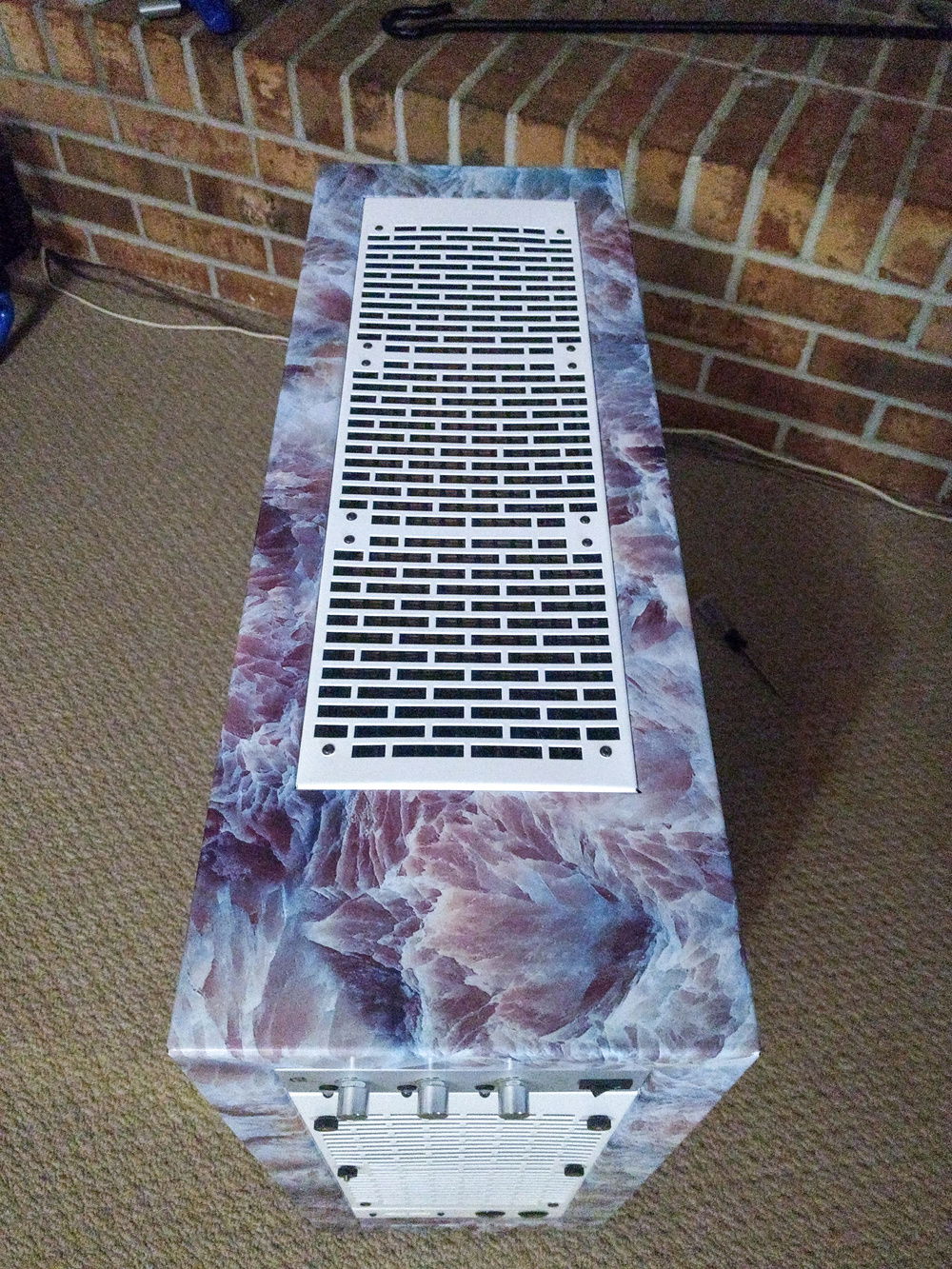 Painted the fan grills white and marble wrapped the top and front.