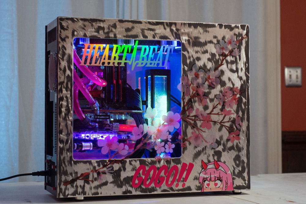 I actually had 3 other custom builds going towards the end of the year and I was really just done with painting stuff. I thought since the case is aluminum, I could just take it down to raw aluminum and that would look cool. The powder coat had other plans. Eventually I just said screw it and slapped some stickers on it and called it done.