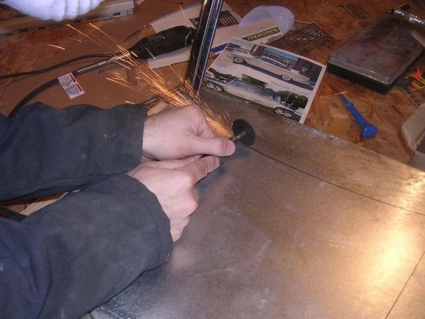 Cutting out the hood - You can see the reference material in the background