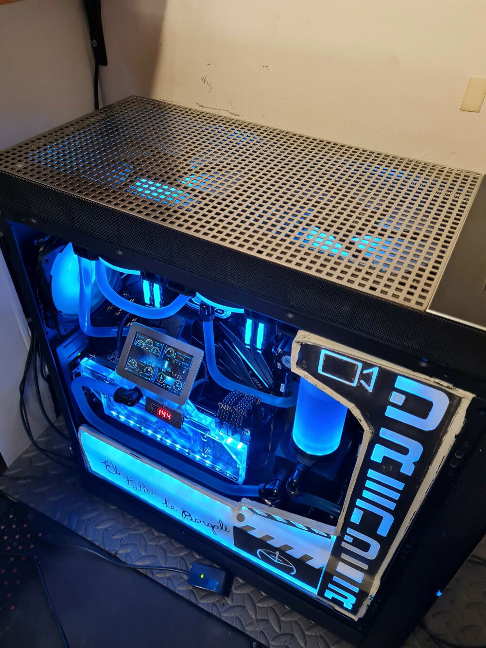 placement of perforated steel grill on top cover to improve airflow.