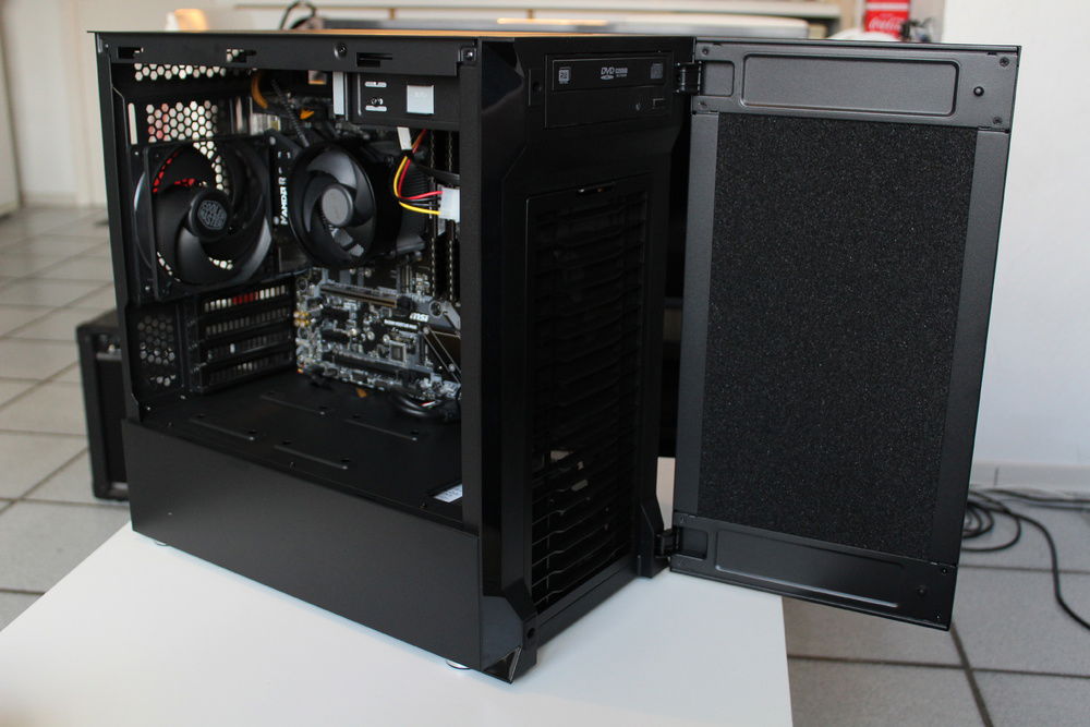 Swing out dust filter panel, that hides the DVD/CD drive.