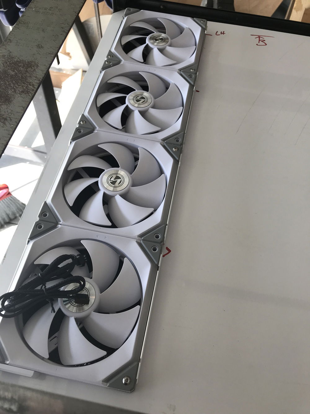 getting the exhaust fans/radiator laid out now the first batch of fans have come in. these Lian Li Uni fans look so awesome!