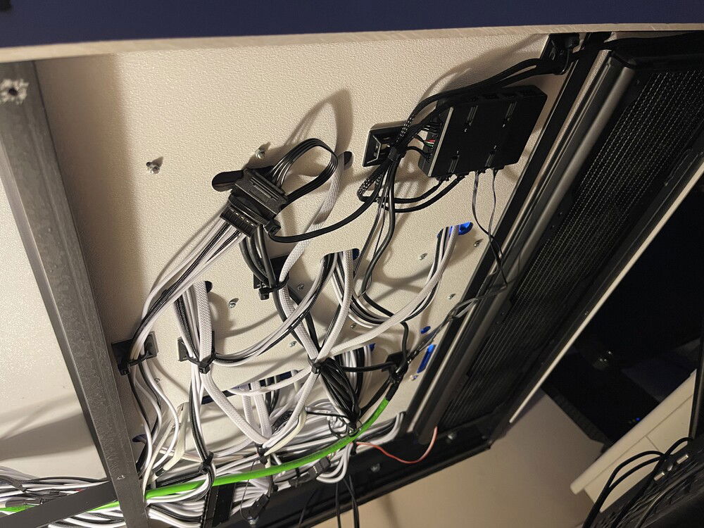 It’s been a while since I’ve  had time to work on it and updated pics. The underside of my desk. Got to get all of these cables straightened out and covered up.