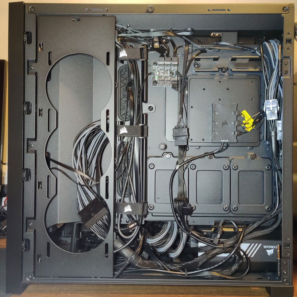 Lots of cables. Quick tip for anyone using those Corsair RGB hubs, the lengthwise distance between the screws on the back of the hub actually line up with the screw holes for SSD mounts, so you can actually remove two of the screws from the hub and use them to screw the hub into an SSD mount, saving you from having to use any of that nasty double sided tape.