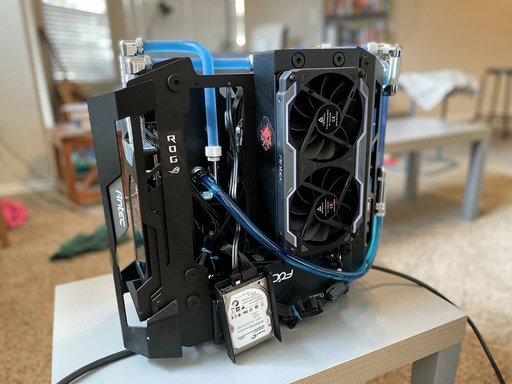 Soft tubing is used for coolant out from the reservoir. Two Antec Prizm Cooling Matrix push-and-up set up w/ the radiator, blowing hot air out off the case.
