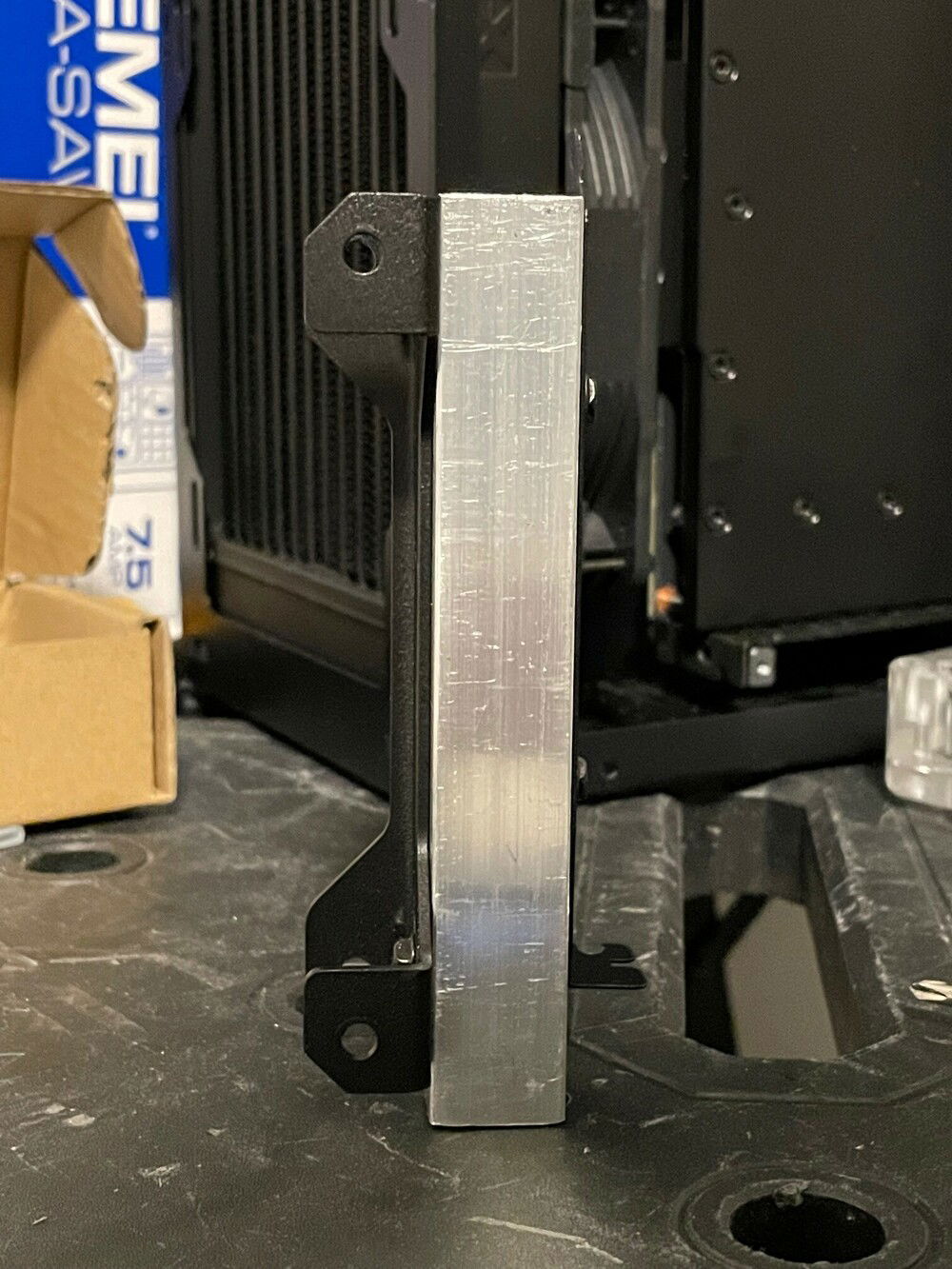 Mating the EK FLT120 bracket with PCIE slot cover using a piece of 10mm x 10mm aluminum square profile.