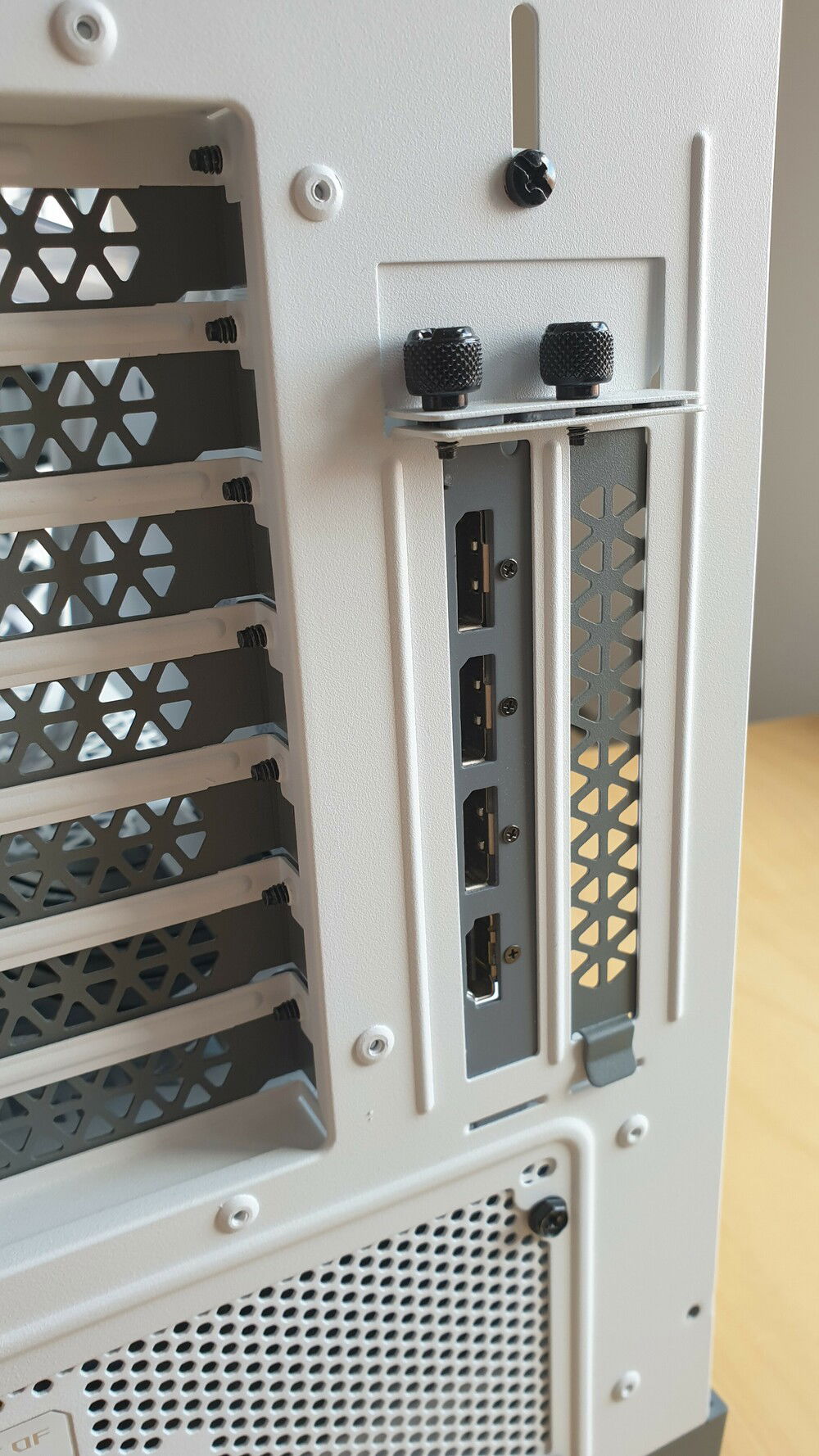 Close-up of the painted GPU bracket to match the grey colour scheme of the other slot covers.
