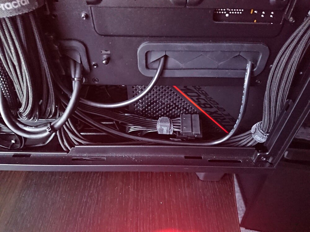 It's hidden away behind a plastic tray...
(not sure what that red hue is in the image...)