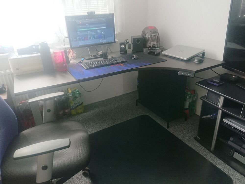 My new desk, telescopic.
(don't look at those bottles of water and soda, lol, I stocked up recently on a couple bundles and put them there to prevent dog from getting at the cables... we have a puppy beagle, 3 months old, she loves biting stuff, especially cables... and me)