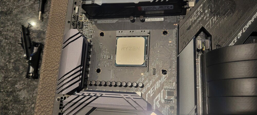 Cleaned up the thermal paste and removed the clip retainers.