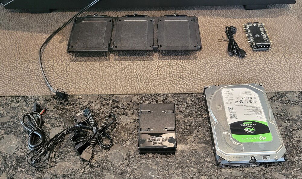 A few more components to add today before working on the cables. These are going to be on the back of the motherboard tray so this work will be done with the chassis on the counter. This is a steel chassis so moving it is a workout (22kg or 48.5 lbs)