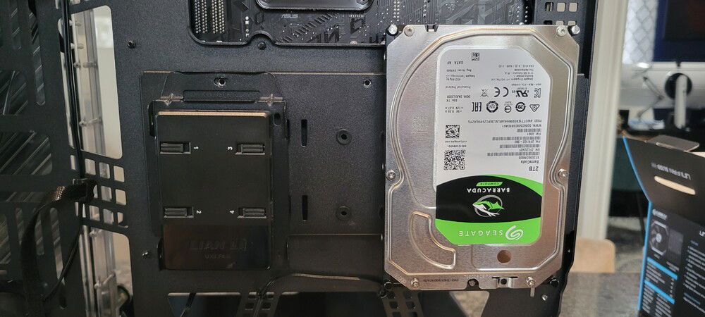 The fan controller comes with double-sided adhesive pads so I stuck it to a drive sled.