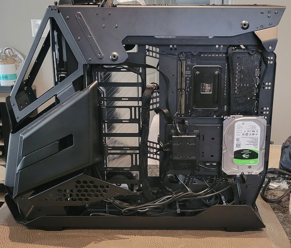 Alright, I caved and connected the front panel wires. Added a bit to the rat's nest but I had issues finding a good spot for the SATA power cable.