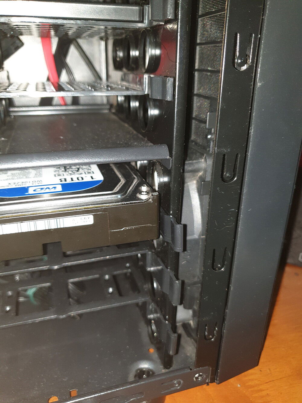 There, a fan at the front panel, it should do the job, and maybe make the hard disk chill a bit