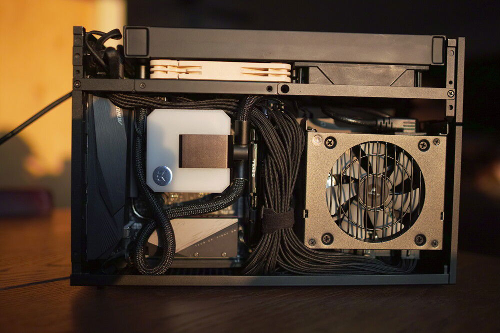 the original plan for this build: a 240mm aio on the cpu. It was just too hot, although I had high hopes since I managed to keep the area above the PSU clear by twisting up the AIO tubes to sit right above the motherboard.