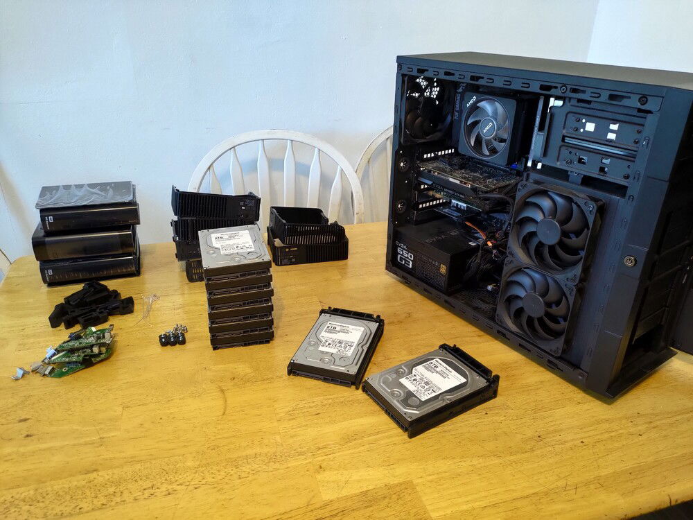 Here's all of the hard drives shucked and stacked together. I bought 2 easy stores and 4 essentials.