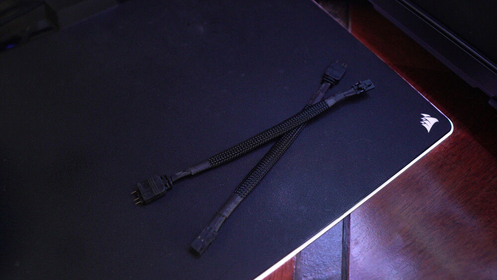 These are 3-pin ARGB to Corsair 3-pin adapters from Pirate Dog (can be bought on eBay). These are amazing and let me use non-corsair lighting in iCue. My entire build can be controlled via iCue.