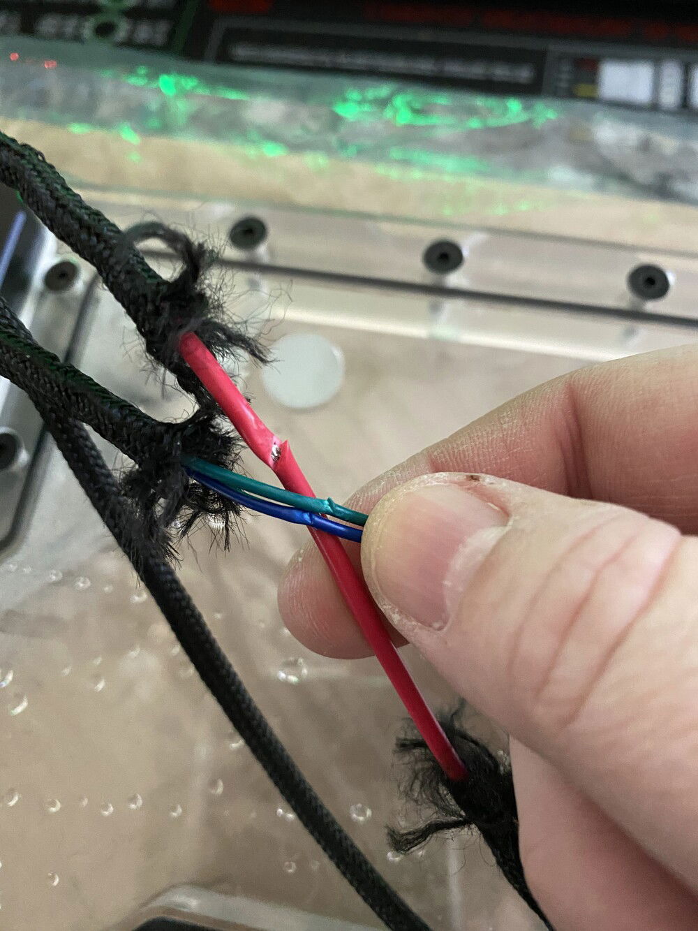 Here is an image of the severed/cut wires from the original D5 pump that came with the Reflection Distribution plate. I originally had a D5 Convection pump cover in nickel which looked amazing (see some of the above pictures when I had it installed)! Unfortunately when I routed the cables through the hole they got pinched and cut. I believe this created a circuit or is what caused the short of my 2 commander pros and my original Dark Hero motherboard. 2 RMAs later and one return of the cover, I was back in business. I do hope the Convection gets a revision where the cable routing hole is better chamfered and not so sharp. I really loved it.