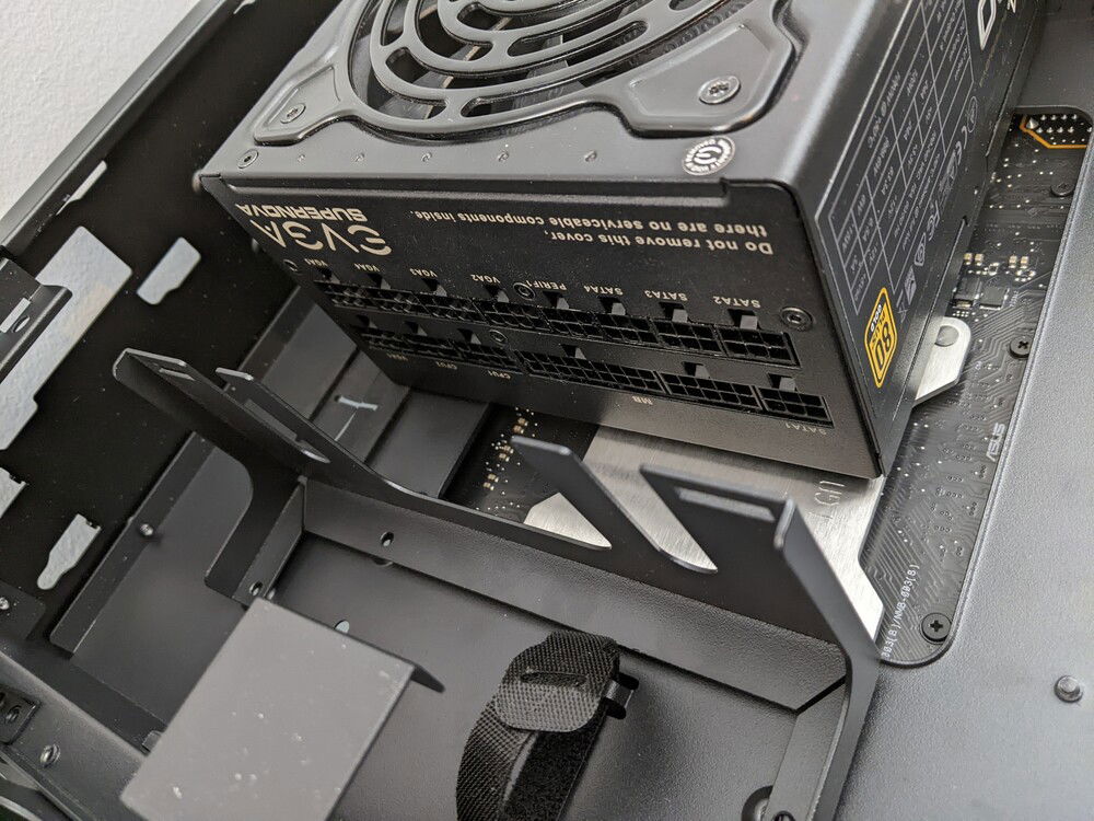 The cable management is fine... but a bit puzzling. There is a cable "tie down" bracket included (installed OOTB) but even with my short EVGA G3 PSU, it doesn't leave enough room if you are using most of your PSU cables.