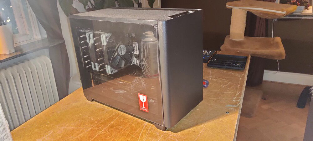 TG panel fits without issue. Cooler does not touch glas from what I can tell.