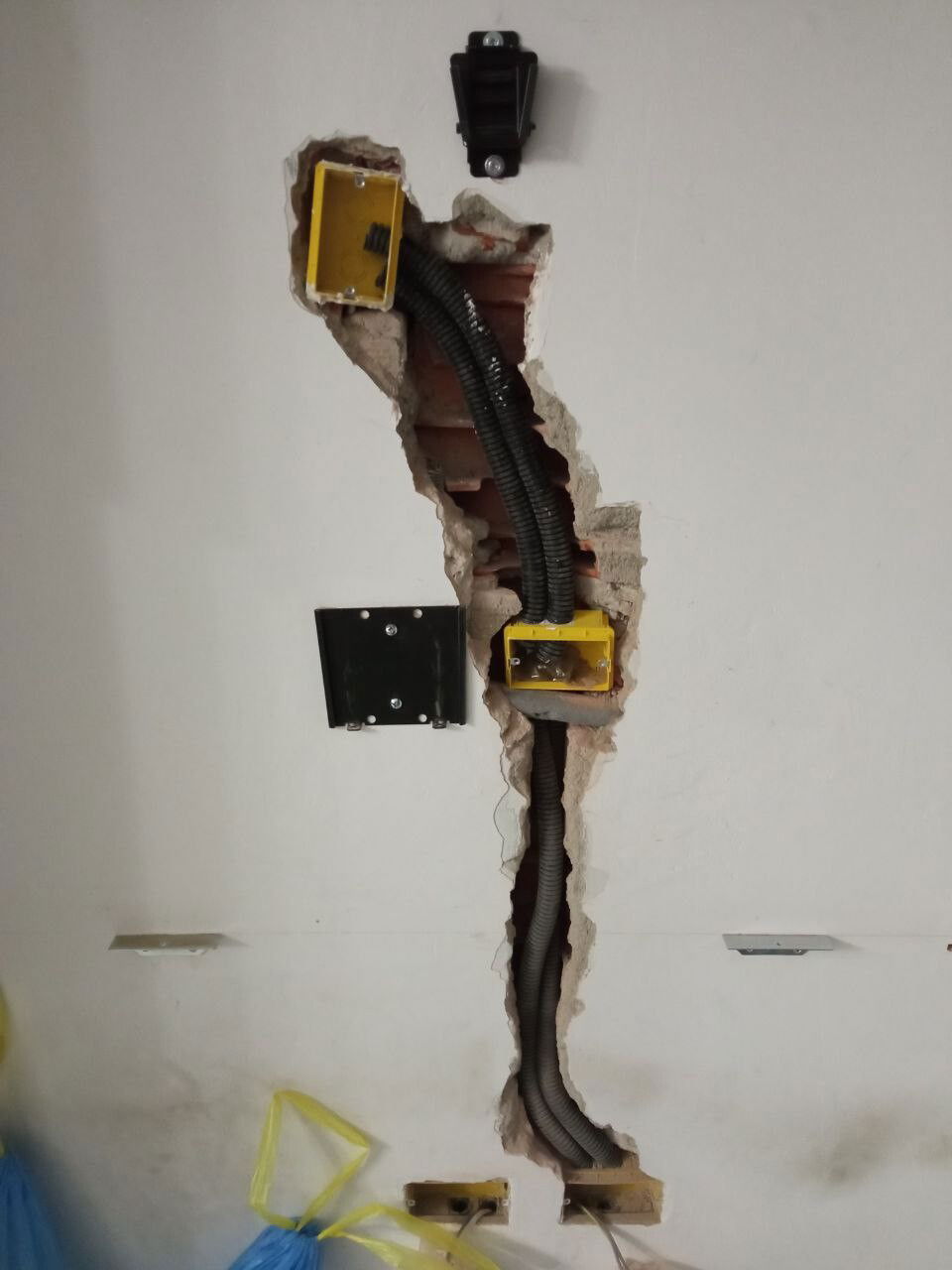 work on the wall to hide cables