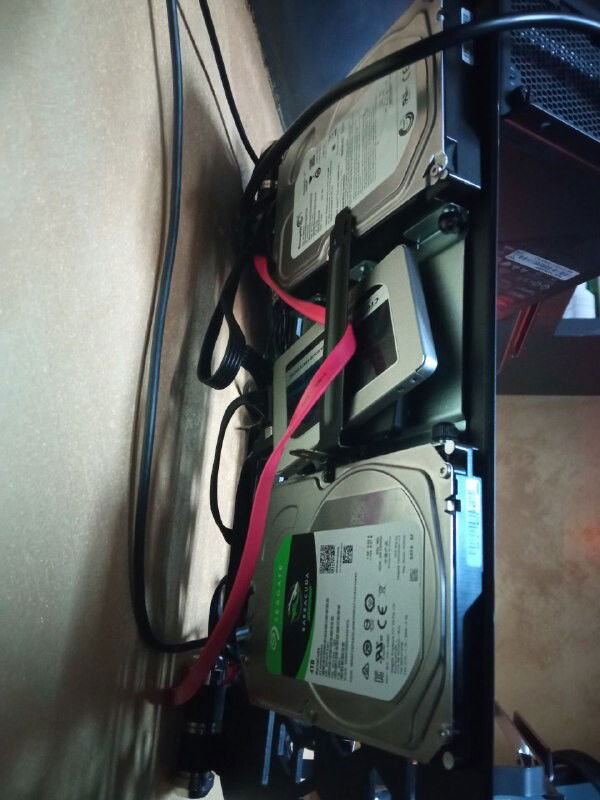 behind the left wing, 2 ssd and 2 hdd