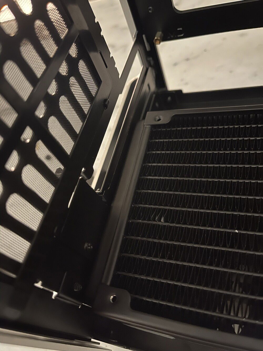 The bottom radiator only leaves space for a single slot GPU :o