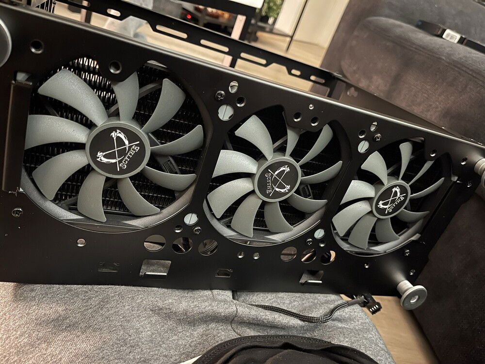 3x Scythe slim fans in the bottom, filtered of course.