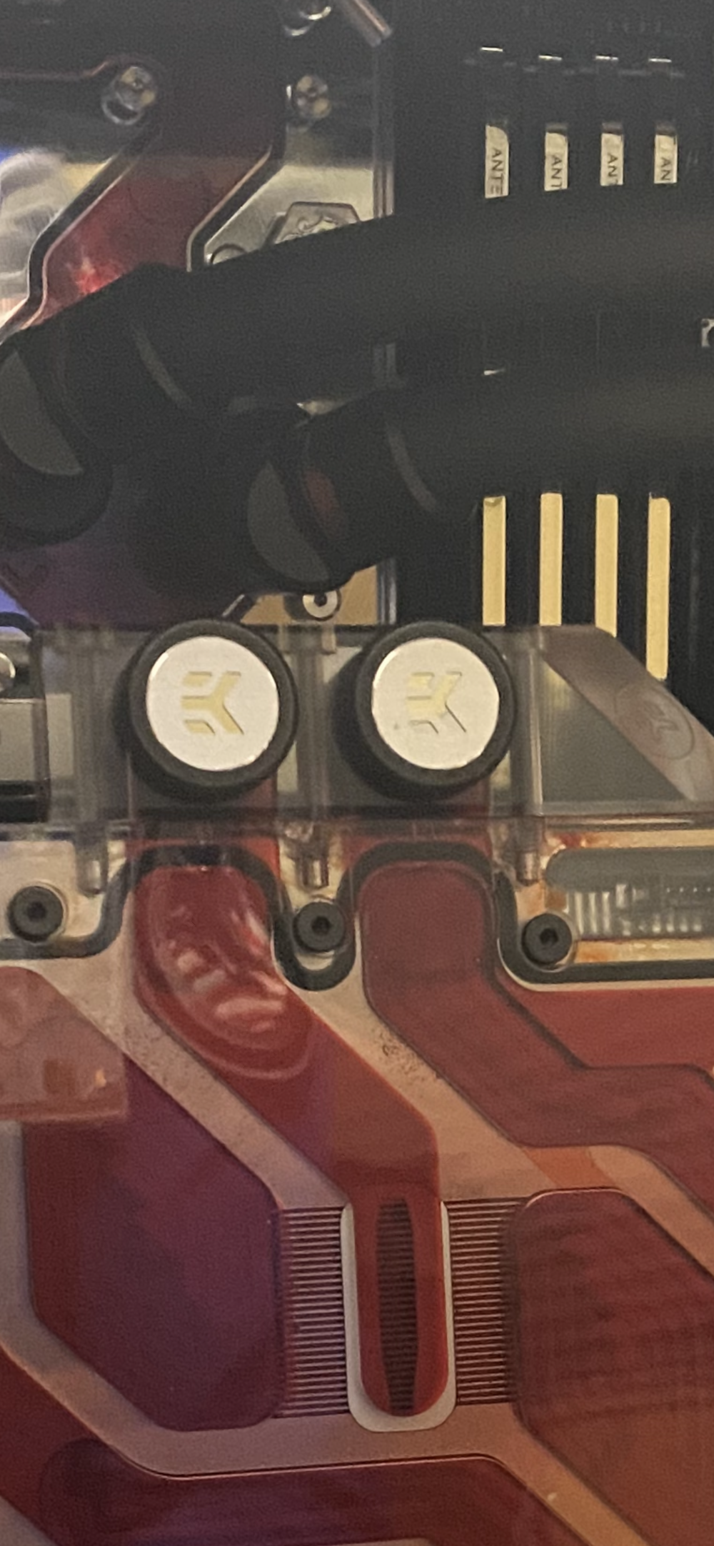 After filling, I found liquid seeping out of these cracks around the terminal.  

The cause of the cracks  were due to over tightening two screws (middle & right).

After finding this, I immediately drained the system, disassembled the waterblock and found that the PCB was still dry. Thank goodness. 

Ended up ordering the Optimus block.