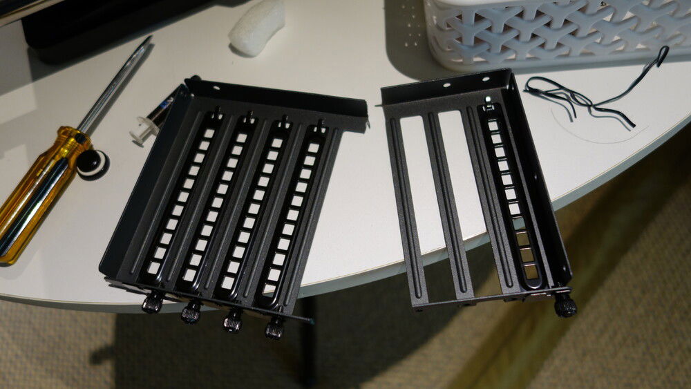 because of the horizontal mount, i wanted to cut the PCI bracket so it wouldn't cast a dark shadow on the mobo. Kept only what I need to secure the GPU