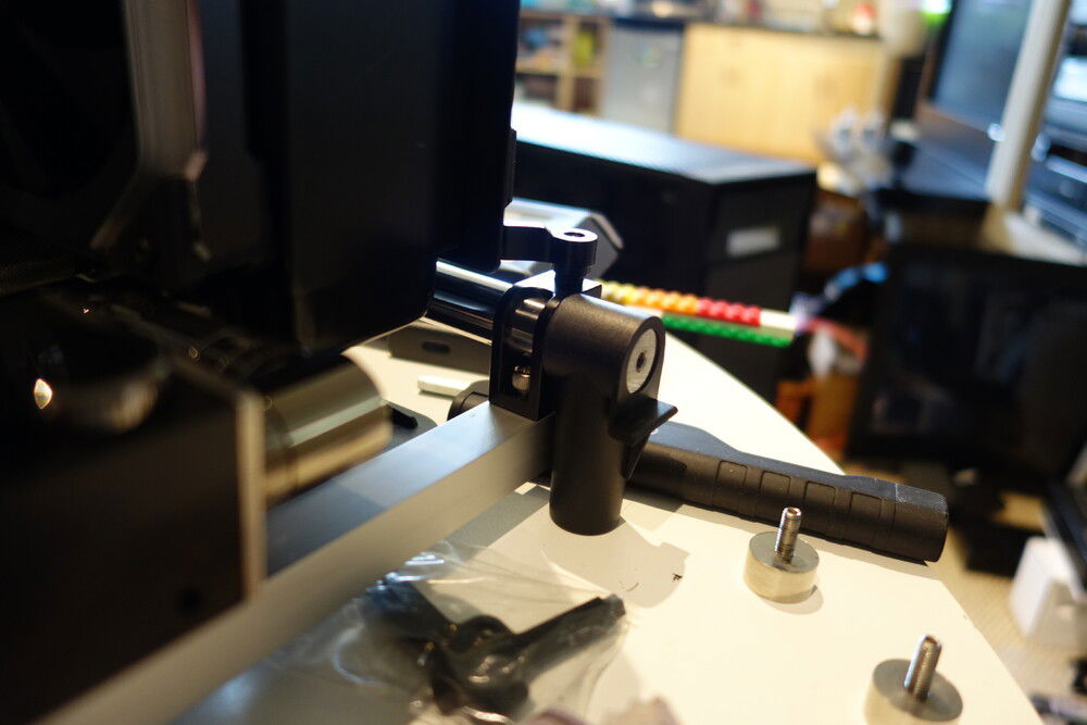 to support the weight of the manifold and all the tubing attached, i fashioned a brace using an aluminum angle and attached it to the lower posts using a camera mount which was the perfect diameter to slide over the posts